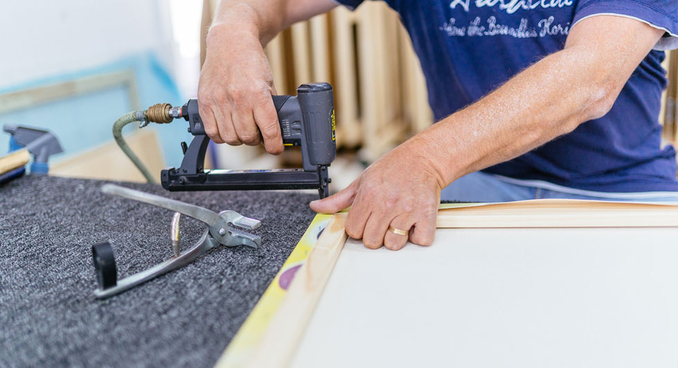 A canvas picture is stretched on the stretcher frame