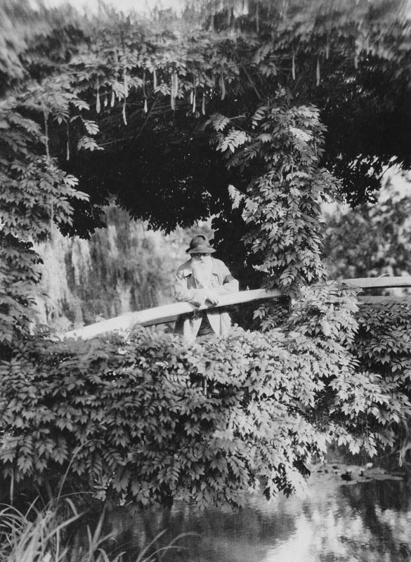 Claude Monet (1841-1926) on the Japanese Bridge in his garden at Giverny, c.1920 (b/w photo)  from French Photographer