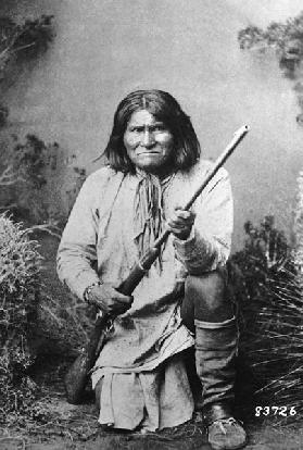 Geronimo holding a rifle, 1884 (b/w photo) 