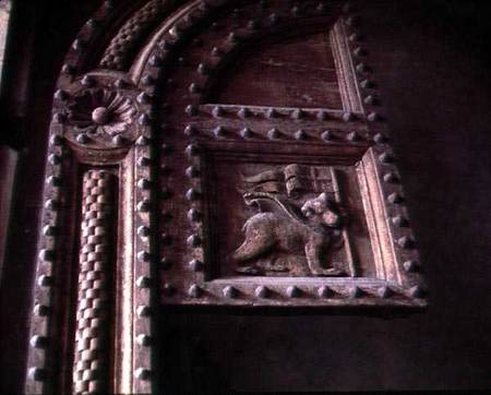 Carved door panel from the Duomoshowing a bear cub carrying a flag from Anonymous painter