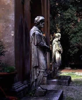 The main entrancedetail of two statues of prisoners on guard