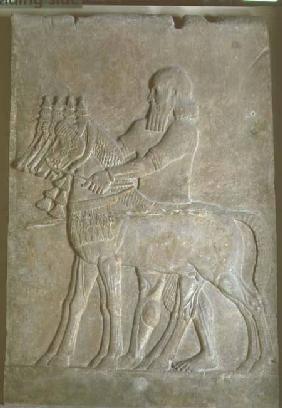 Relief of a man holding the reins of four horsesfrom the Palace of Sargon II (721-705 BC) at Khorsab