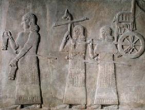 Relief depicting servants carrying drinking vessels and the Royal chariot, from the Palace of Sargon