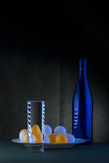 Still life with blue bottle and balls