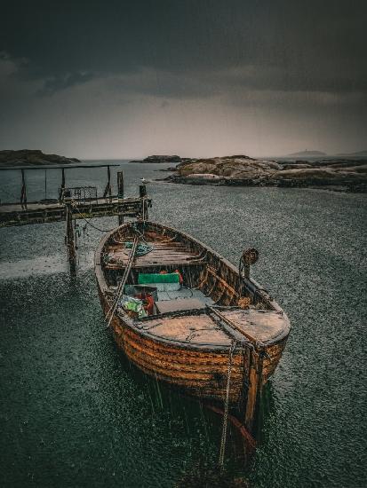 Old fishingboat in the rain