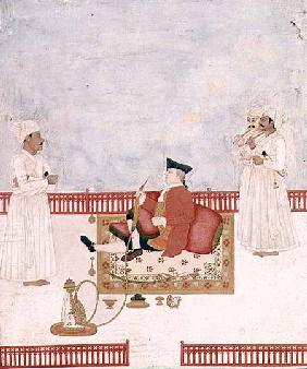A European Seated on a Terrace with Attendants