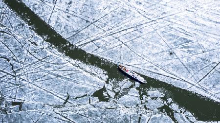 Ship on icy lake