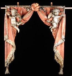 Pair of Putti supporting curtains