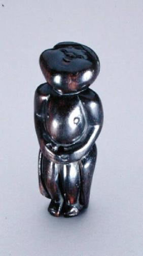 Netsuke of a standing bashful Okame looking up at the moon c.1780-1910