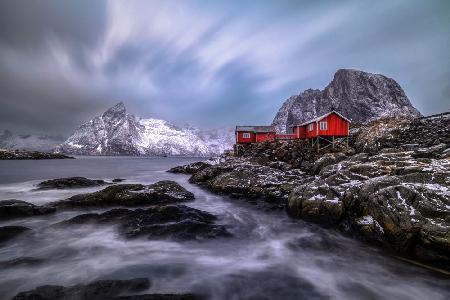 Red huts on rocks