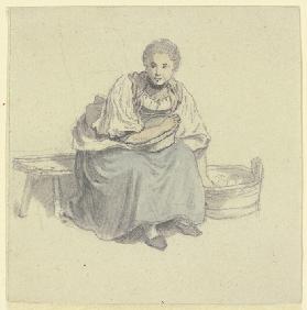 Sitzende Frau mit Holzbütte