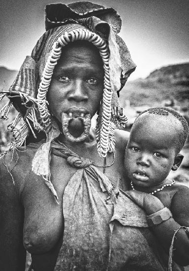 Mursi woman with her child (Omo Valley - Ethiopia)