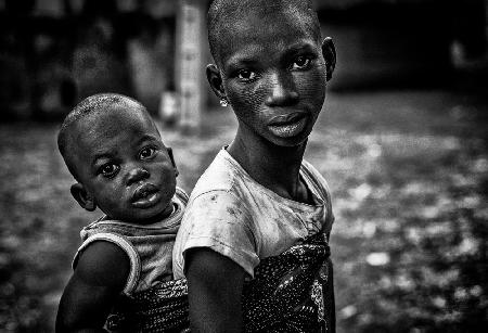 Taking care of her brother - Benin