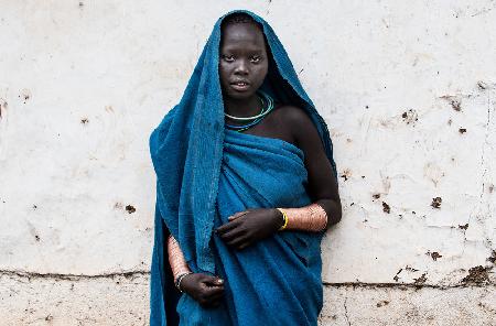 Surma tribe woman in a blue dress - Ethiopia