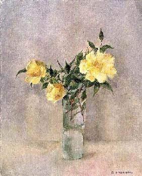 Yellow roses in a glass vase 