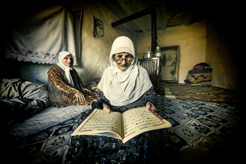 The old woman is reading the Koran. from Mehmet Çetin