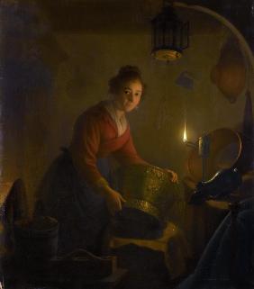 Woman in a Kitchen by Candlelight