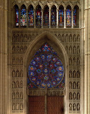 View looking west from the nave, rose window designed by Bernard de Soissons, with surrounding statu from 
