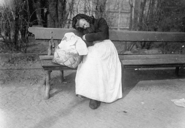 Old woman asleep on a Berlin park bench from 