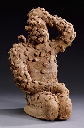 A Djenne Terracotta Kneeling Male Figure, 14th Century