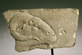 An Egyptian Gray Sandstone Relief Of A Rams Head