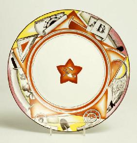 A Soviet Porcelain  Propaganda Plate,  Centre Painted With A Red Star Enclosing A Hammer And A Ploug