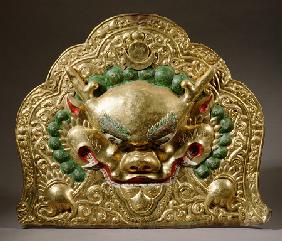 A Tibetan Gilt-Copper Repousse Banner, Depicting A Kirttimukha With A Fierce Expression, 18th Centur