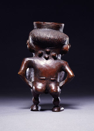 Backview Of A Wongo Cup Carved As A Female Standing Figure With Spherical Body from 