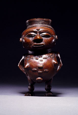 Face On View Of A Wongo Cup Carved As A Female Standing Figure With Spherical Body from 