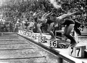 swimming competition at berlin Olympic Games: here swimmers diving in swimmming pool