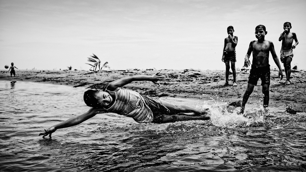 Children in the water from PAUL GOMEZ