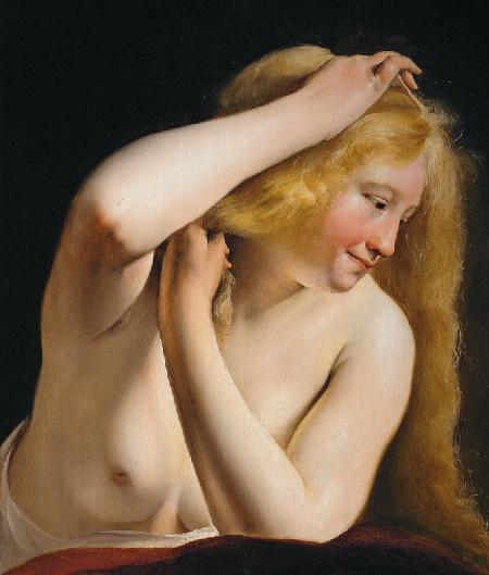 Young Woman Combing Her Hair