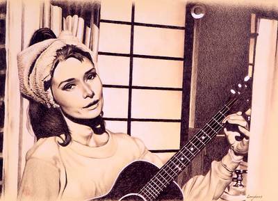 Audrey Hepburn plays the guitar