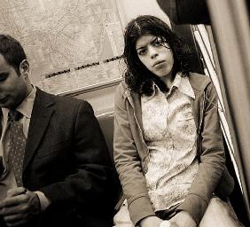 Woman sitting on a subway and staring, 2004 (b/w photo) 