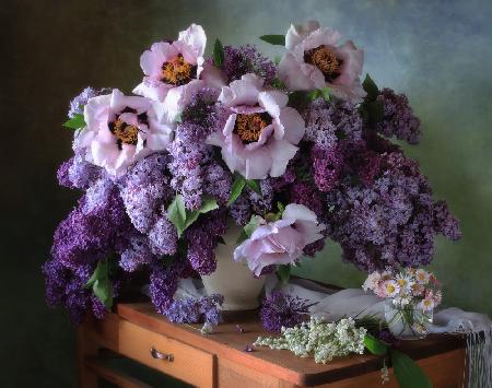 Still life with a bouquet of lilacs and peonies