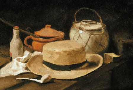 Still life with a yellow straw hat